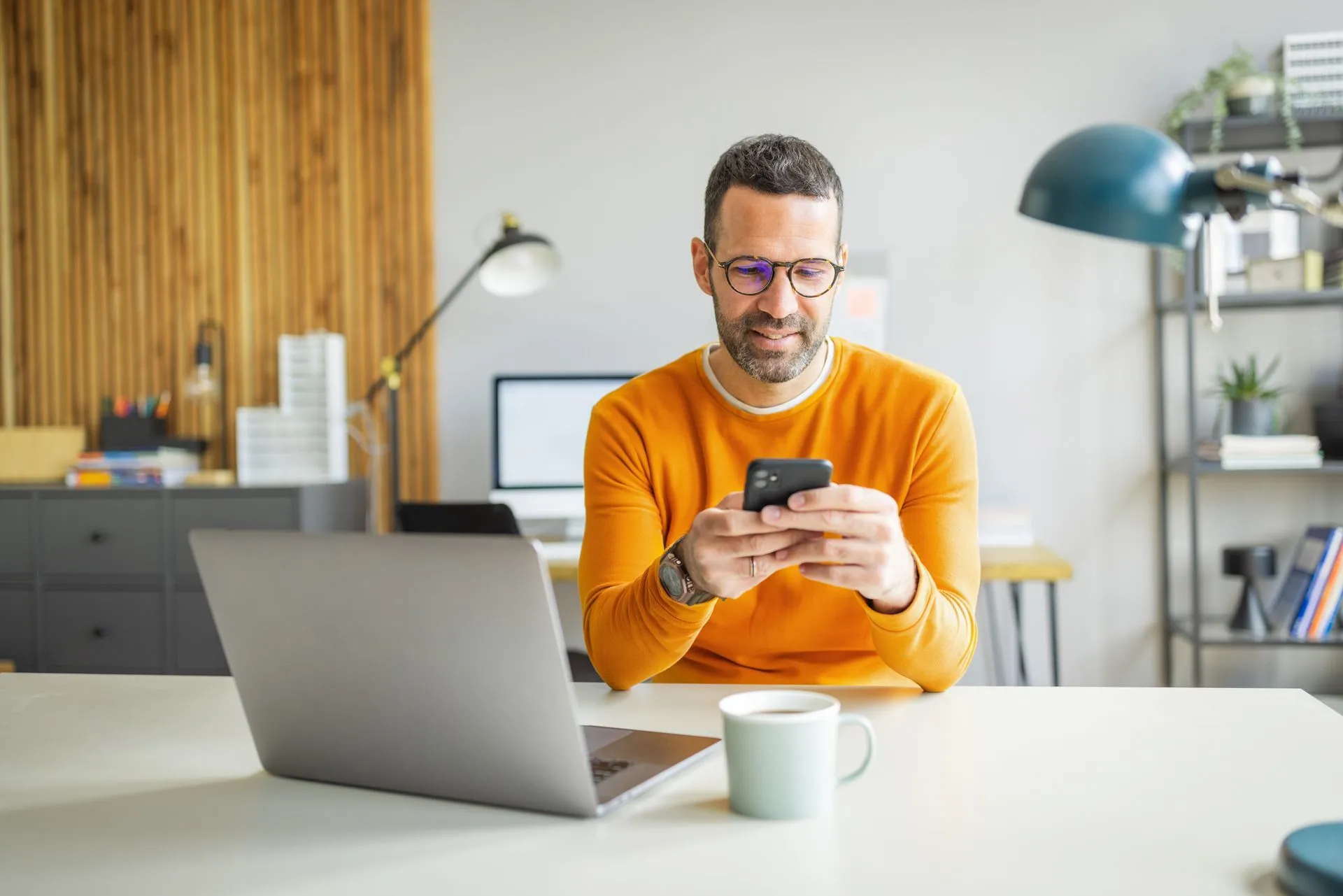 A man on a phone applying for CareCredit financing